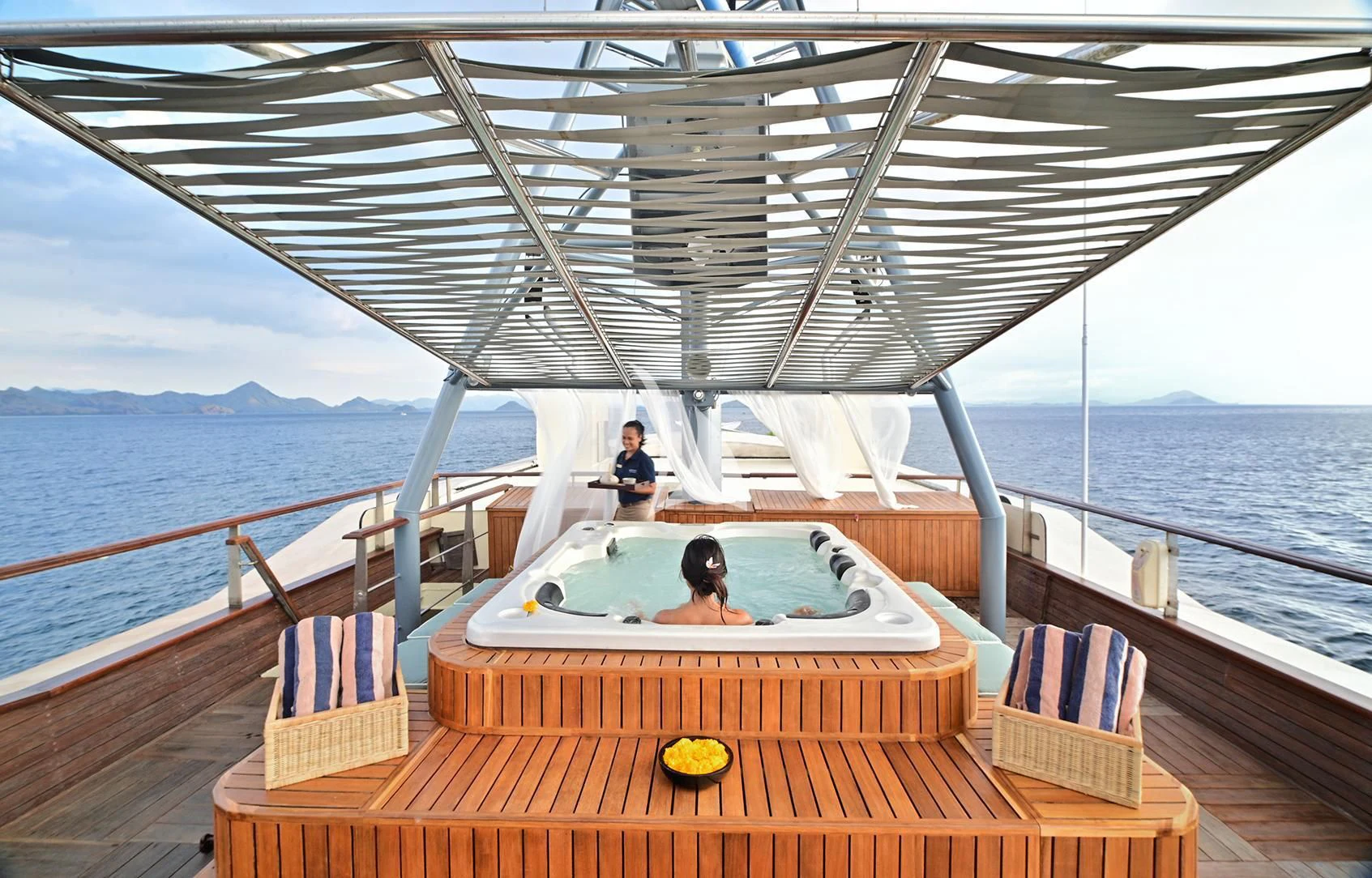 a couple sitting in a boat aboard KUDANIL EXPLORER Yacht for Sale