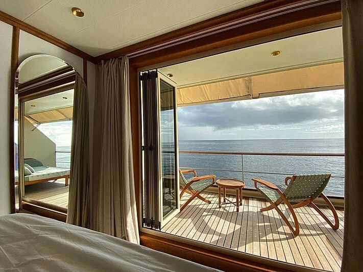 a room with a view of the ocean and the ocean aboard KUDANIL EXPLORER Yacht for Sale