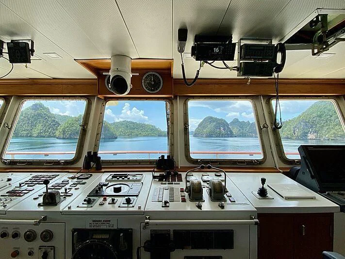a room with a computer and speakers aboard KUDANIL EXPLORER Yacht for Sale