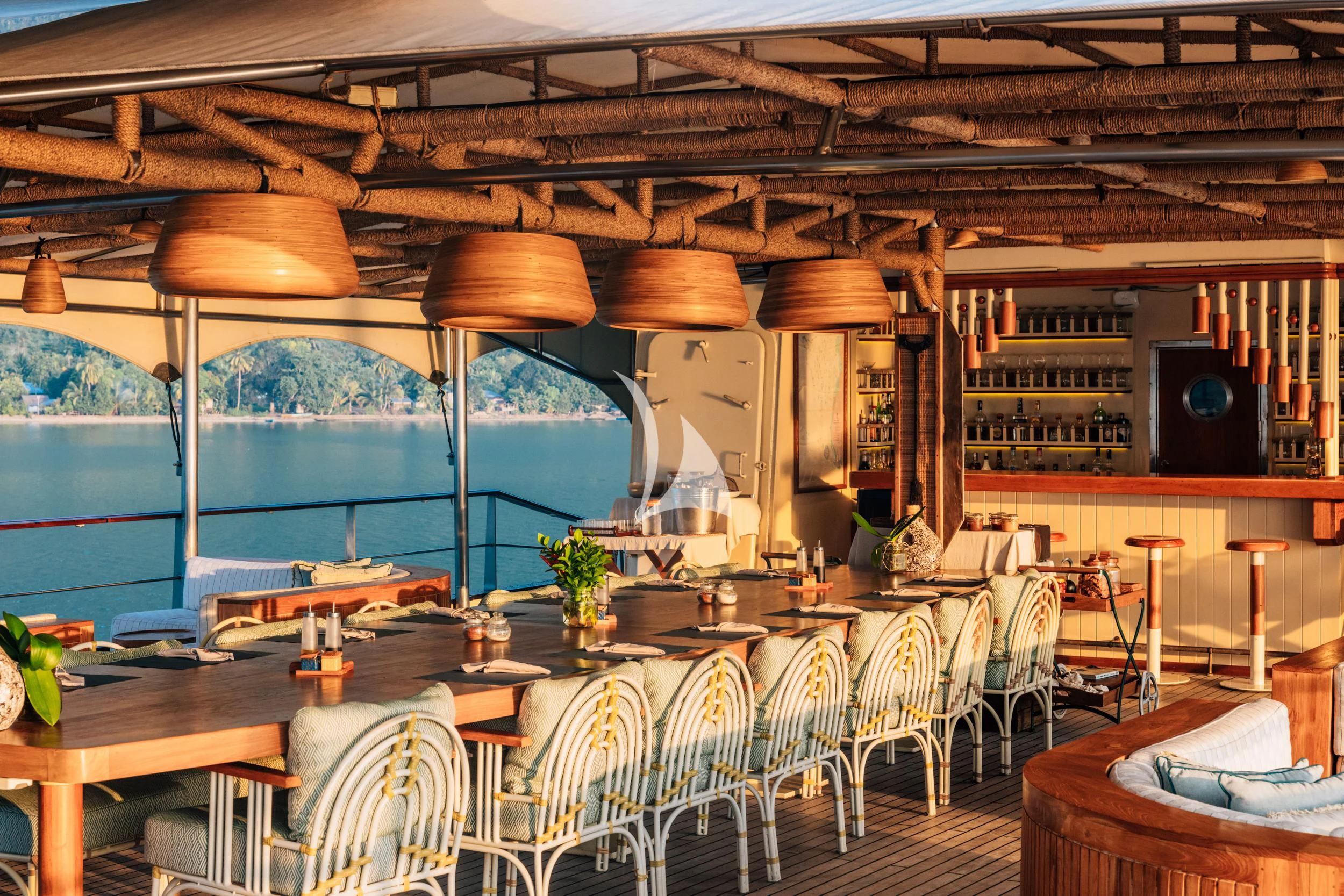 a room with tables and chairs aboard KUDANIL EXPLORER Yacht for Sale