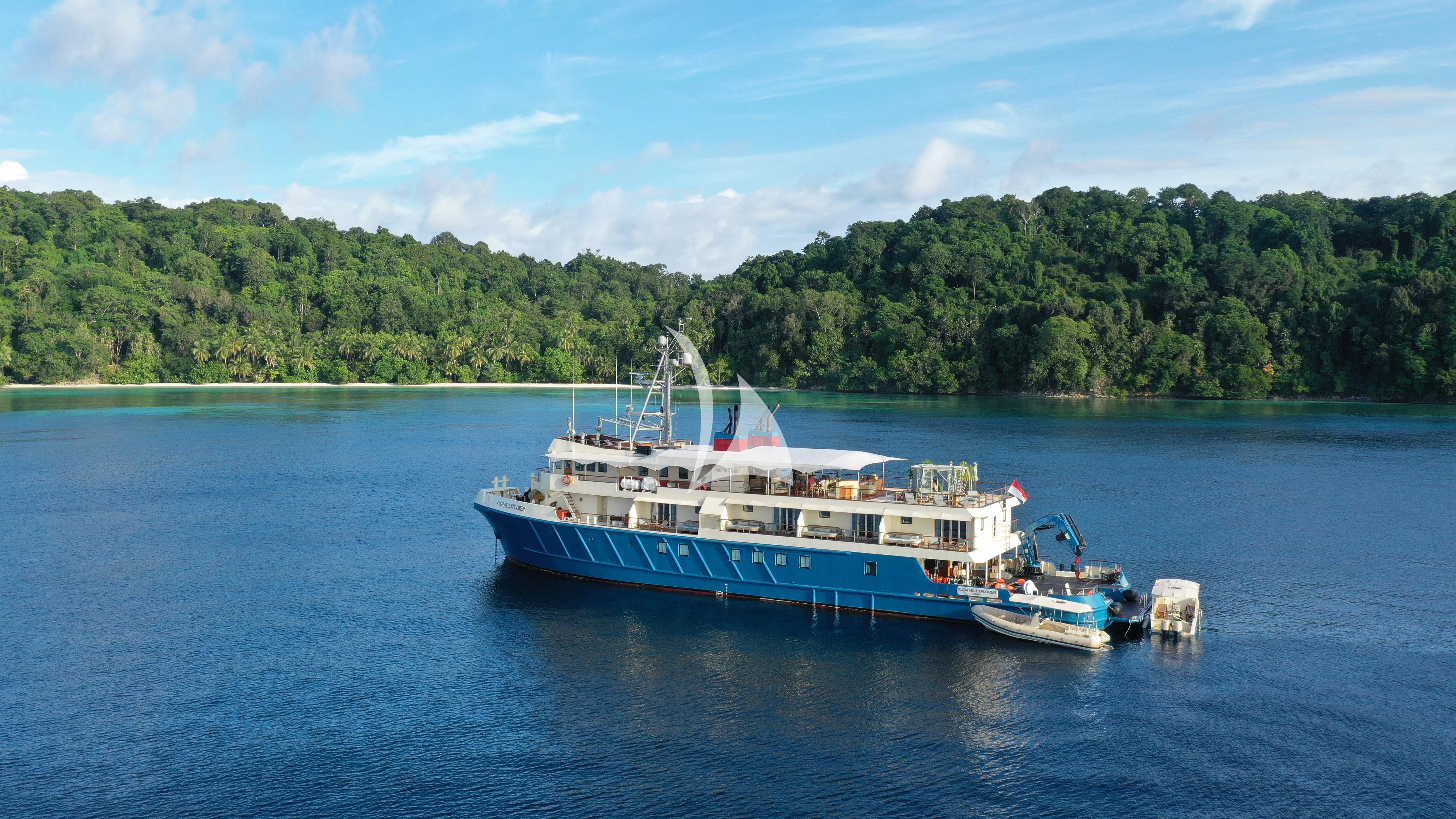 a large boat on the water aboard KUDANIL EXPLORER Yacht for Sale