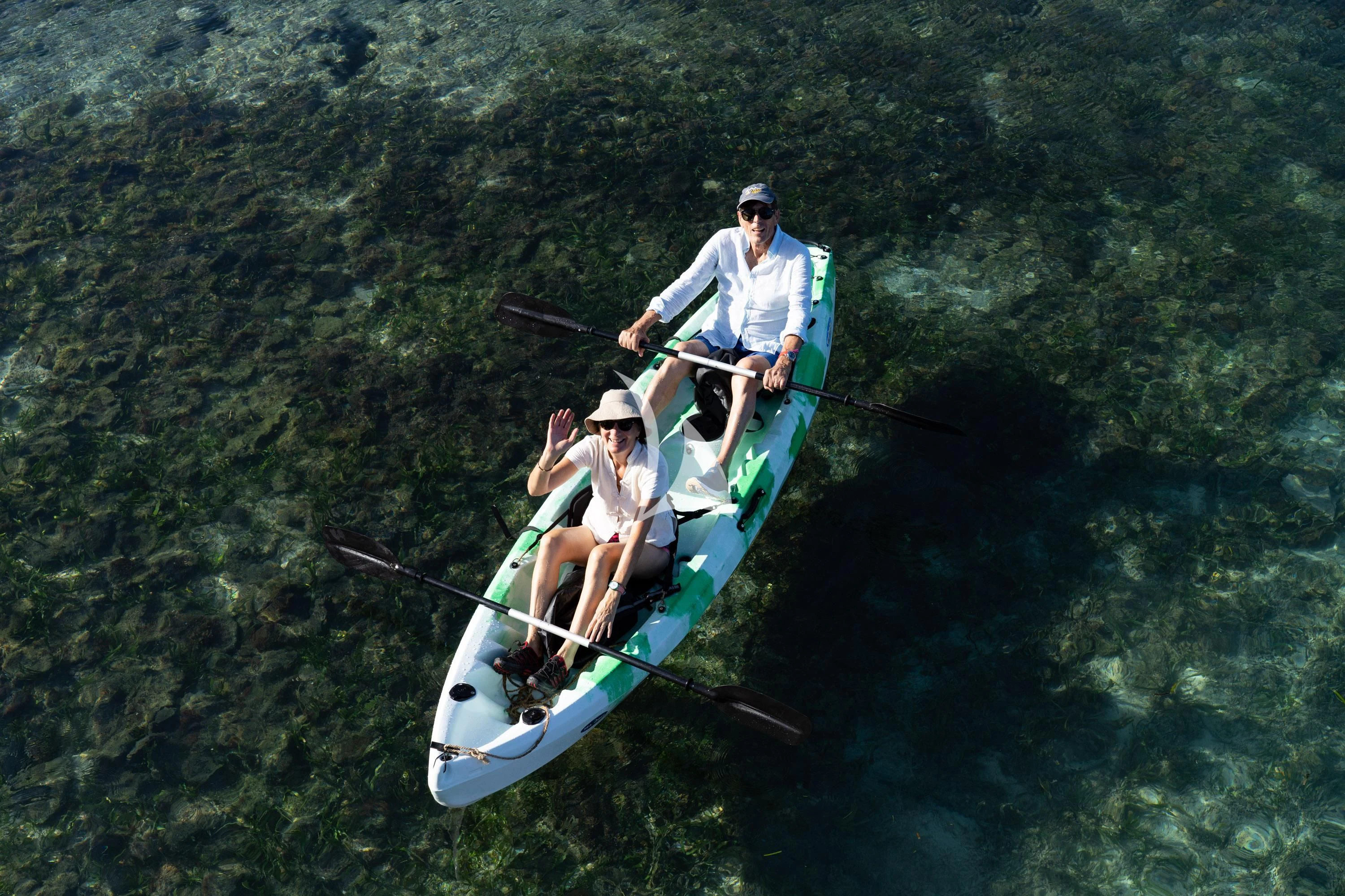 a couple of people in a canoe on a river aboard KUDANIL EXPLORER Yacht for Sale
