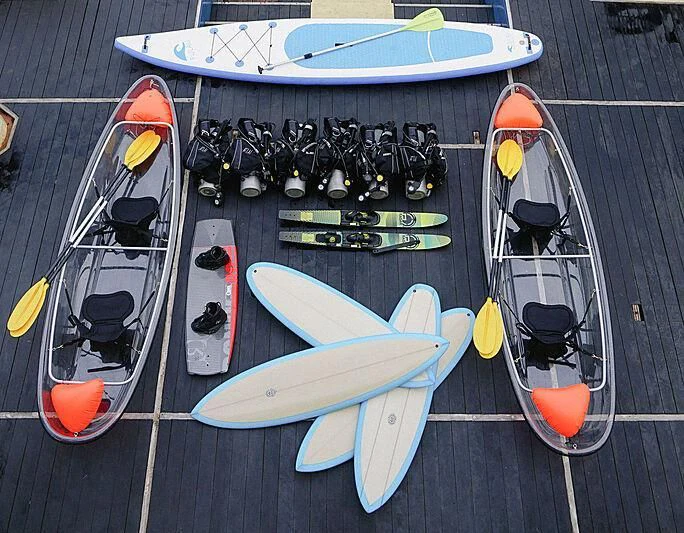 surfboards and paddles on a sidewalk aboard KUDANIL EXPLORER Yacht for Sale