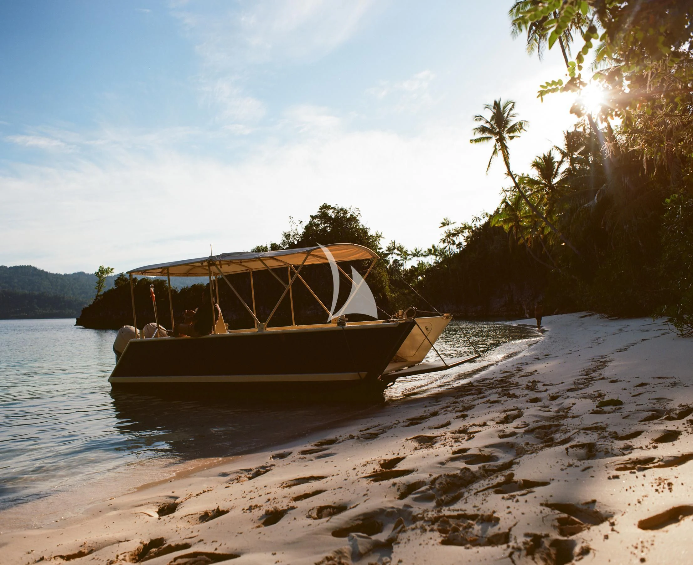 a boat on a beach aboard KUDANIL EXPLORER Yacht for Sale