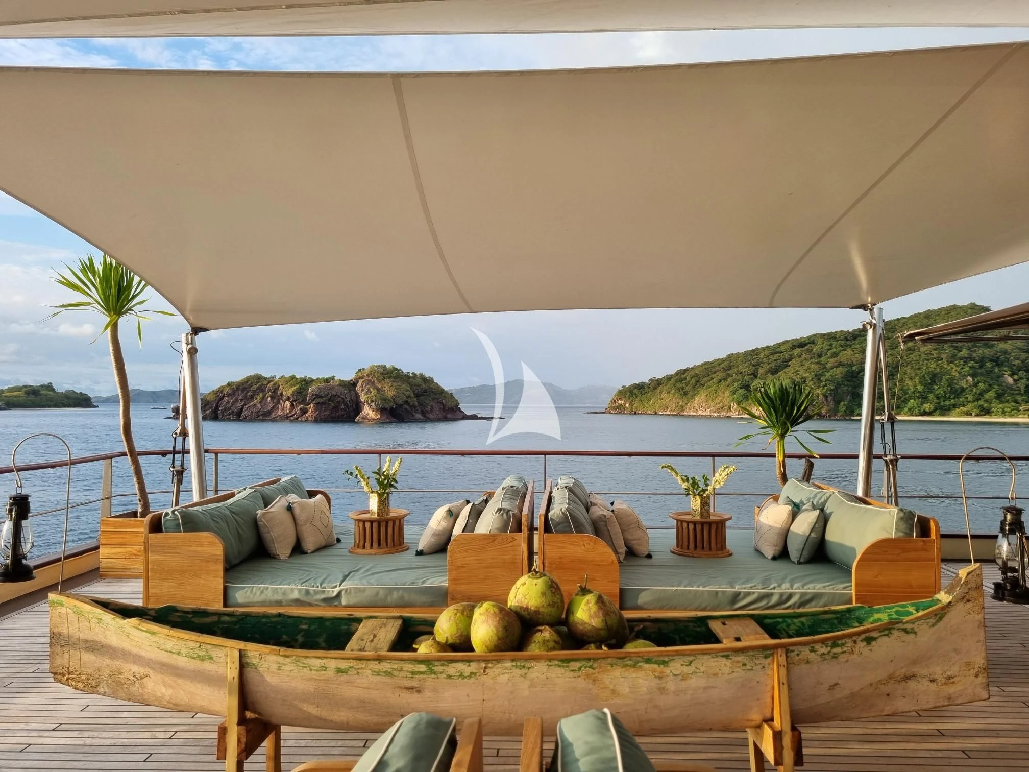 a patio with a table and chairs aboard KUDANIL EXPLORER Yacht for Sale