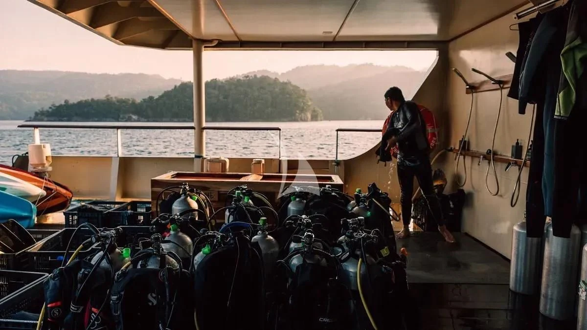 a person standing under a tent aboard KUDANIL EXPLORER Yacht for Sale
