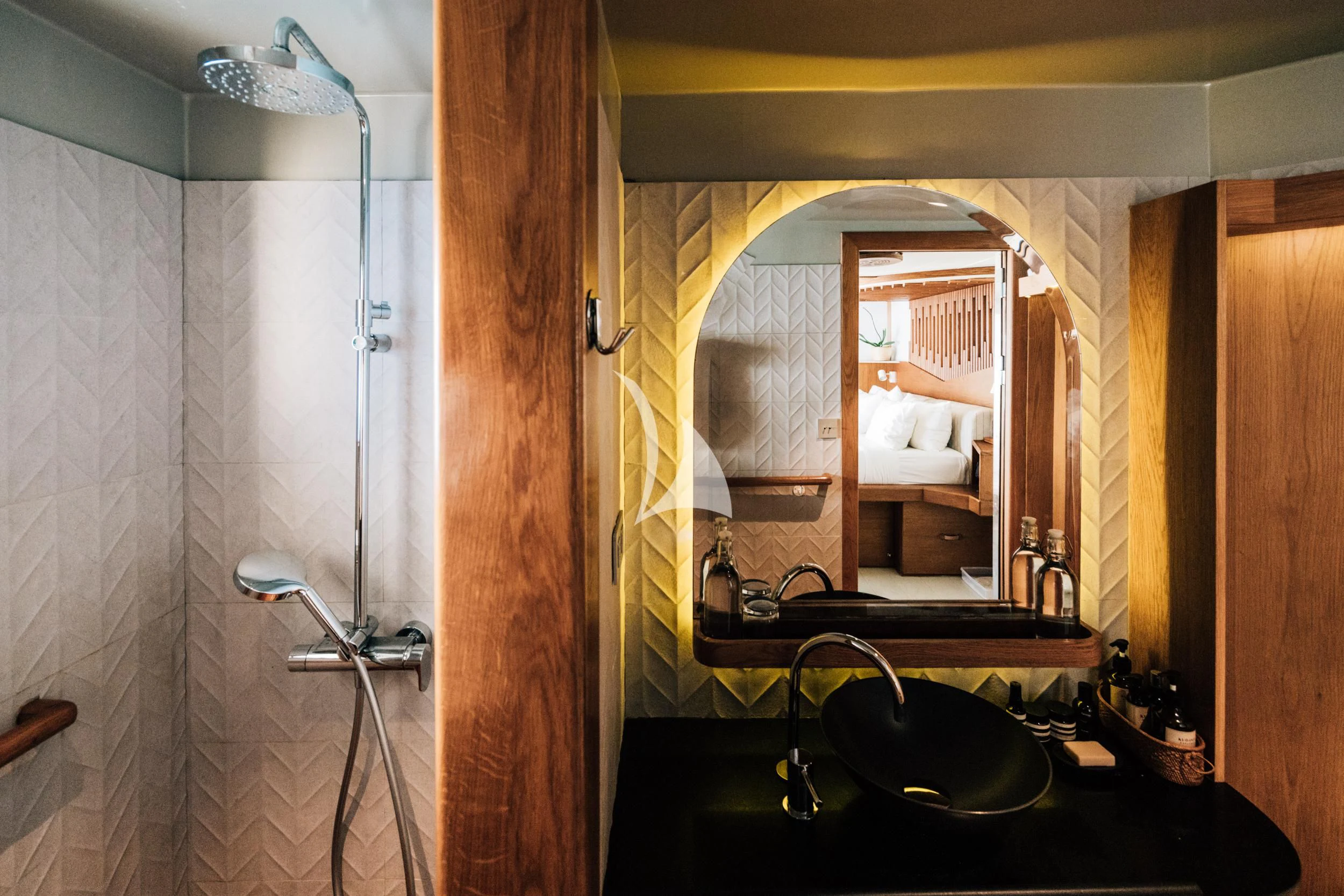 a bathroom with a large mirror aboard KUDANIL EXPLORER Yacht for Sale