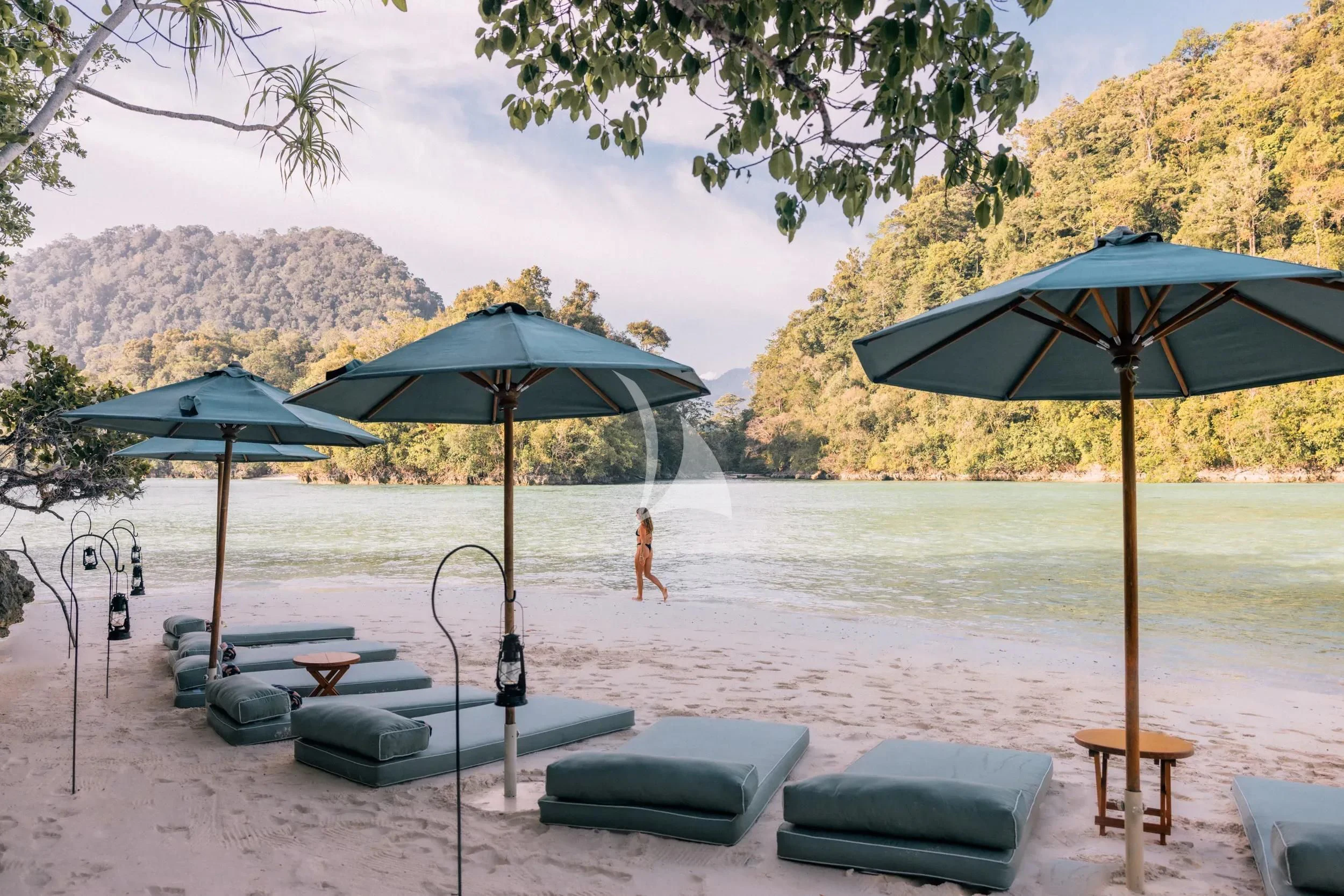 a person walking on a beach aboard KUDANIL EXPLORER Yacht for Sale