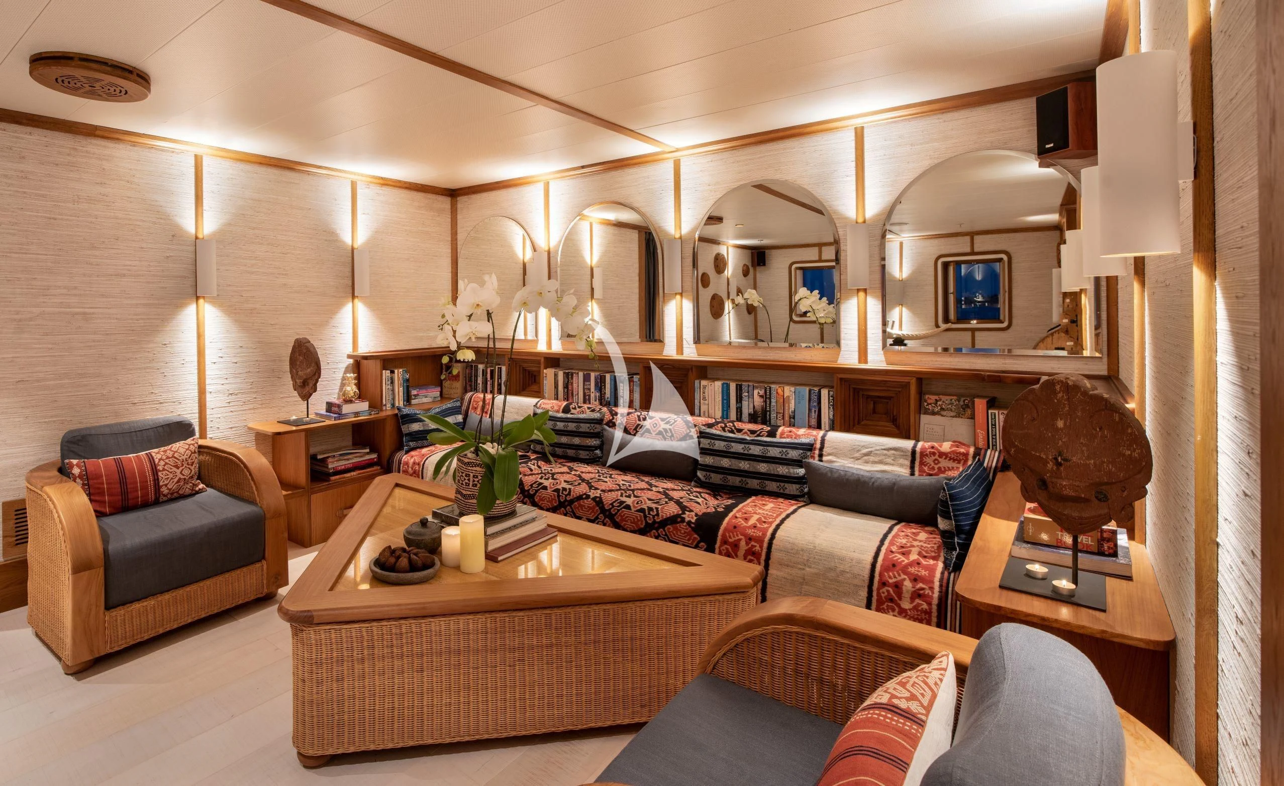 a room with a couch and a coffee table aboard KUDANIL EXPLORER Yacht for Sale
