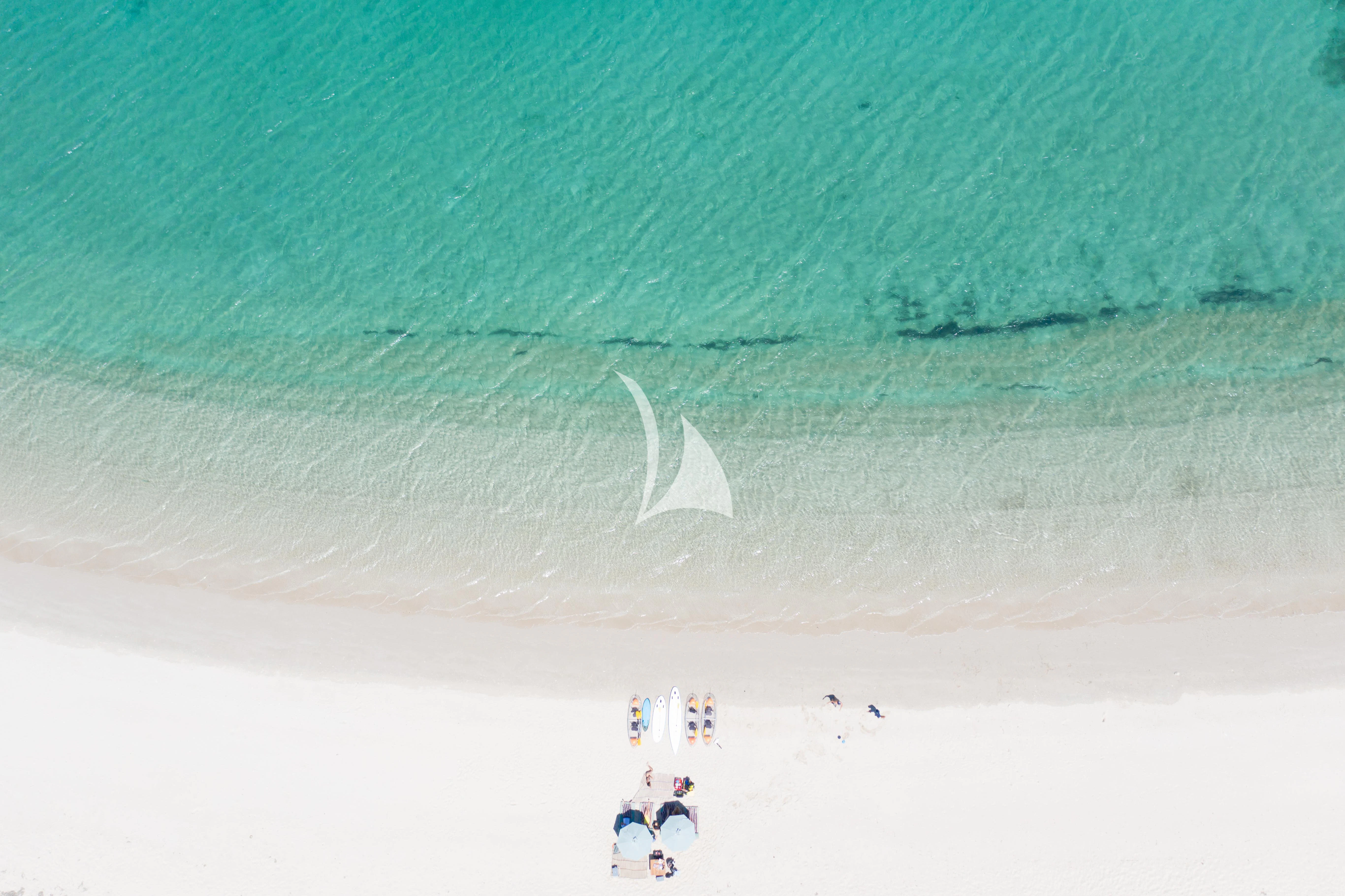 a group of people swimming in the water aboard KUDANIL EXPLORER Yacht for Sale