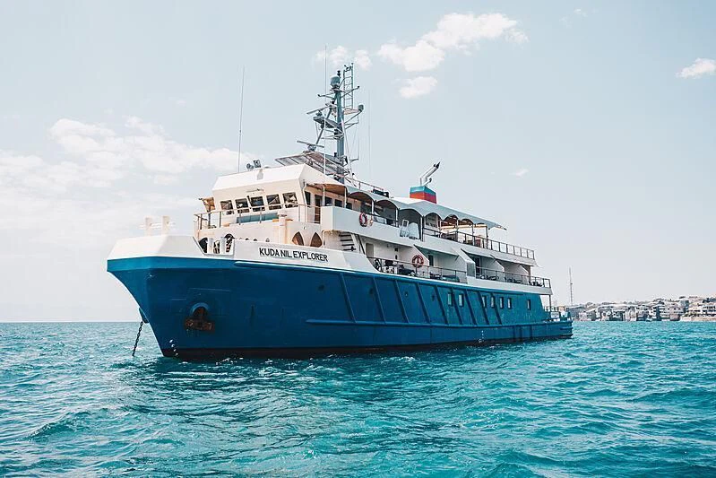 a large boat in the water aboard KUDANIL EXPLORER Yacht for Sale