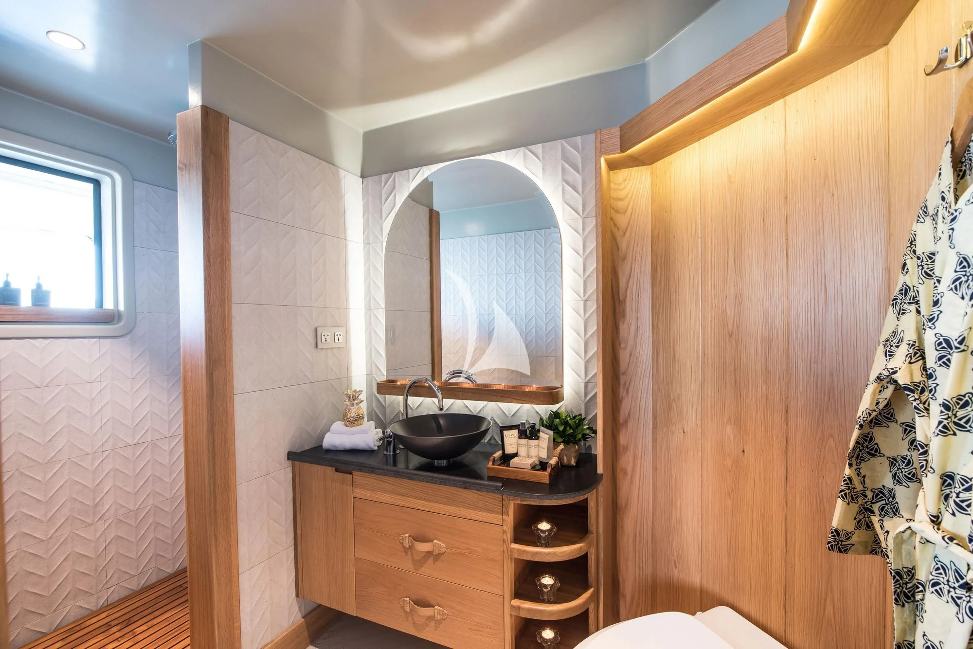 a bathroom with a sink and a mirror aboard KUDANIL EXPLORER Yacht for Sale