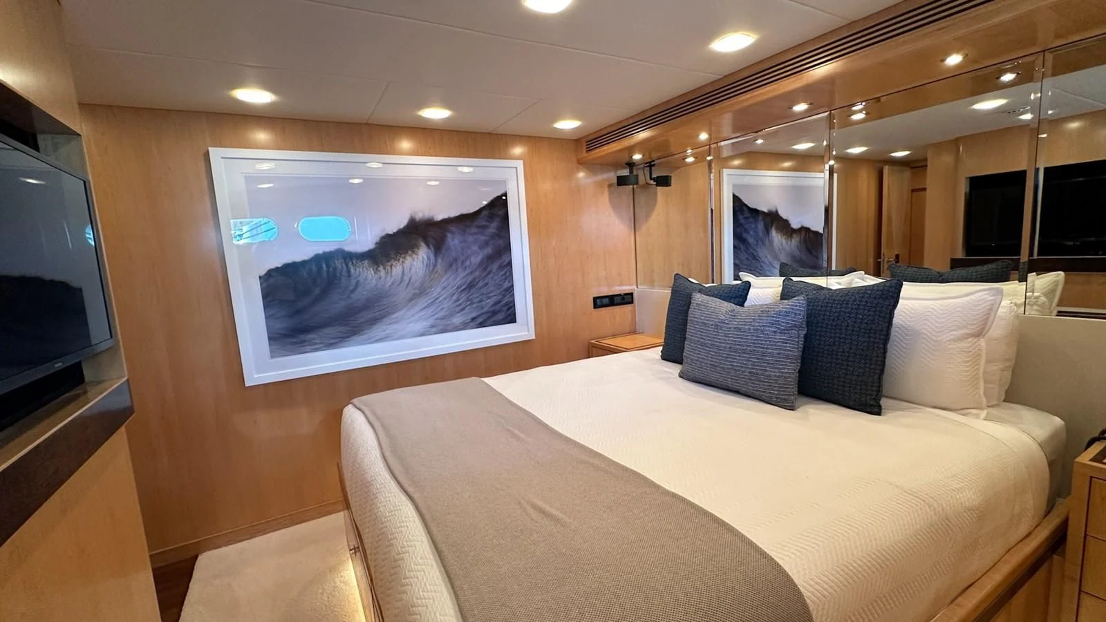 a hotel room with a large bed aboard SALVATORE II Yacht for Sale