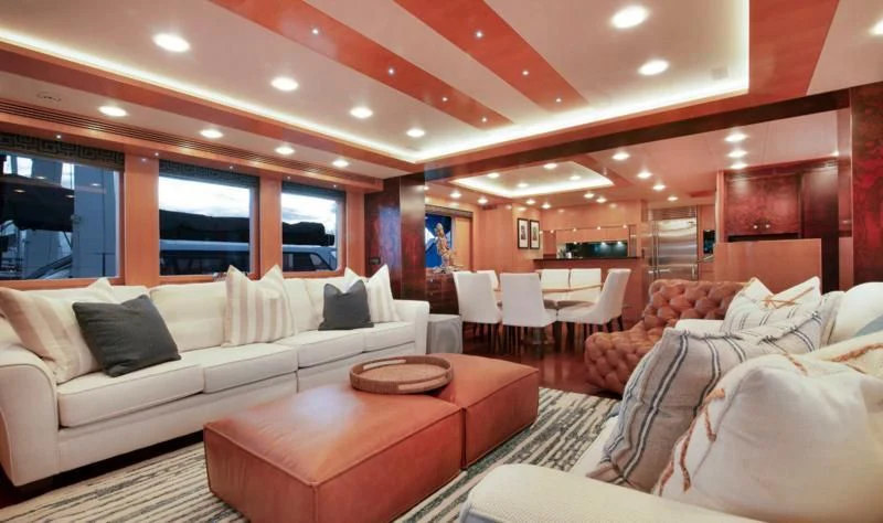 a living room with a couch and a table aboard SALVATORE II Yacht for Sale