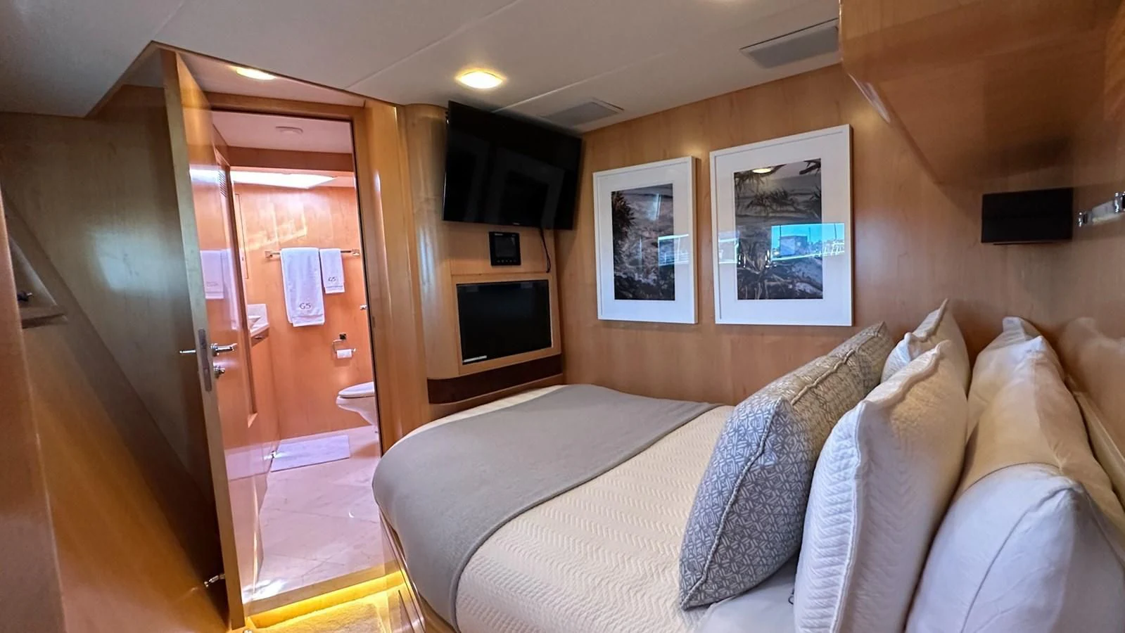 a bed and a television in a room aboard SALVATORE II Yacht for Sale
