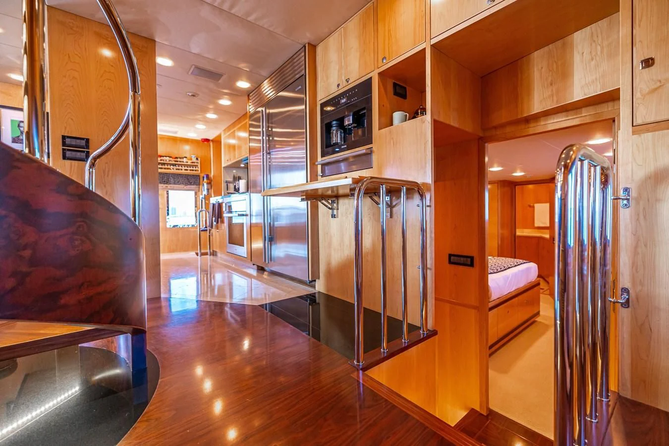 a large room with a wood floor aboard SALVATORE II Yacht for Sale
