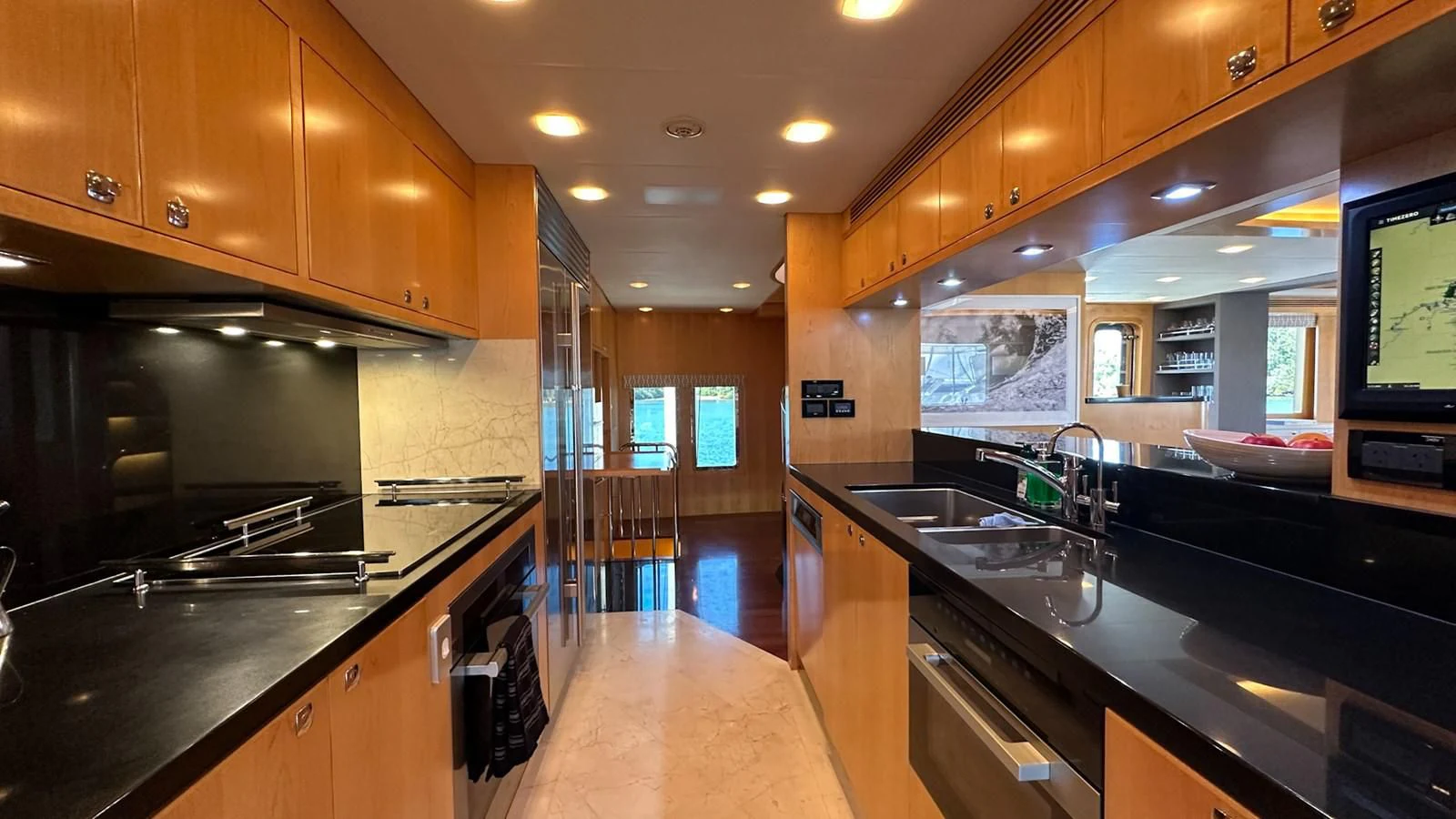 a kitchen with a large island aboard SALVATORE II Yacht for Sale