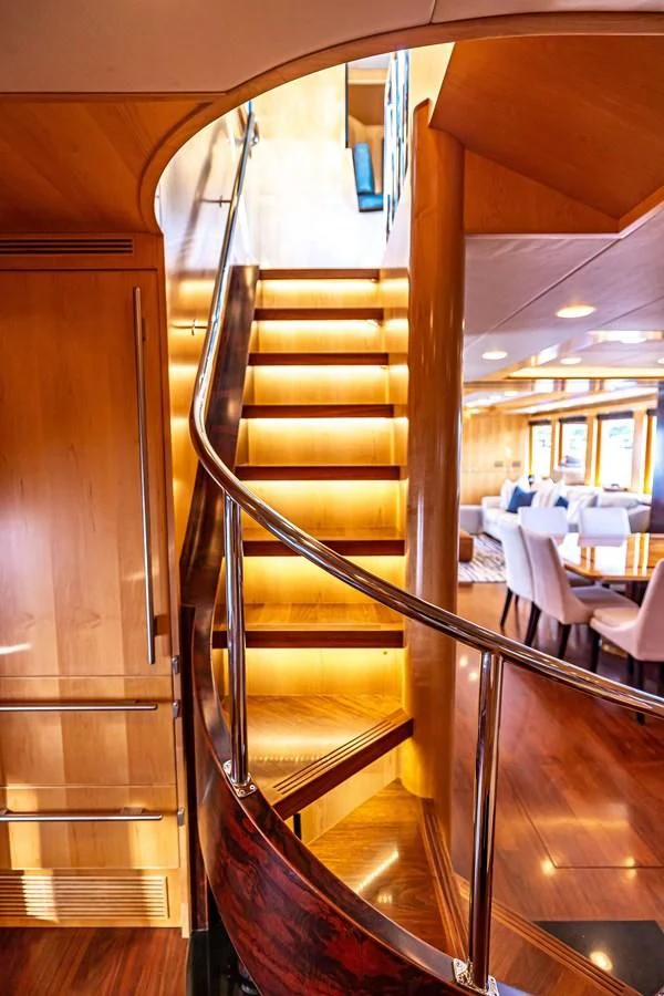 a wooden staircase in a restaurant aboard SALVATORE II Yacht for Sale