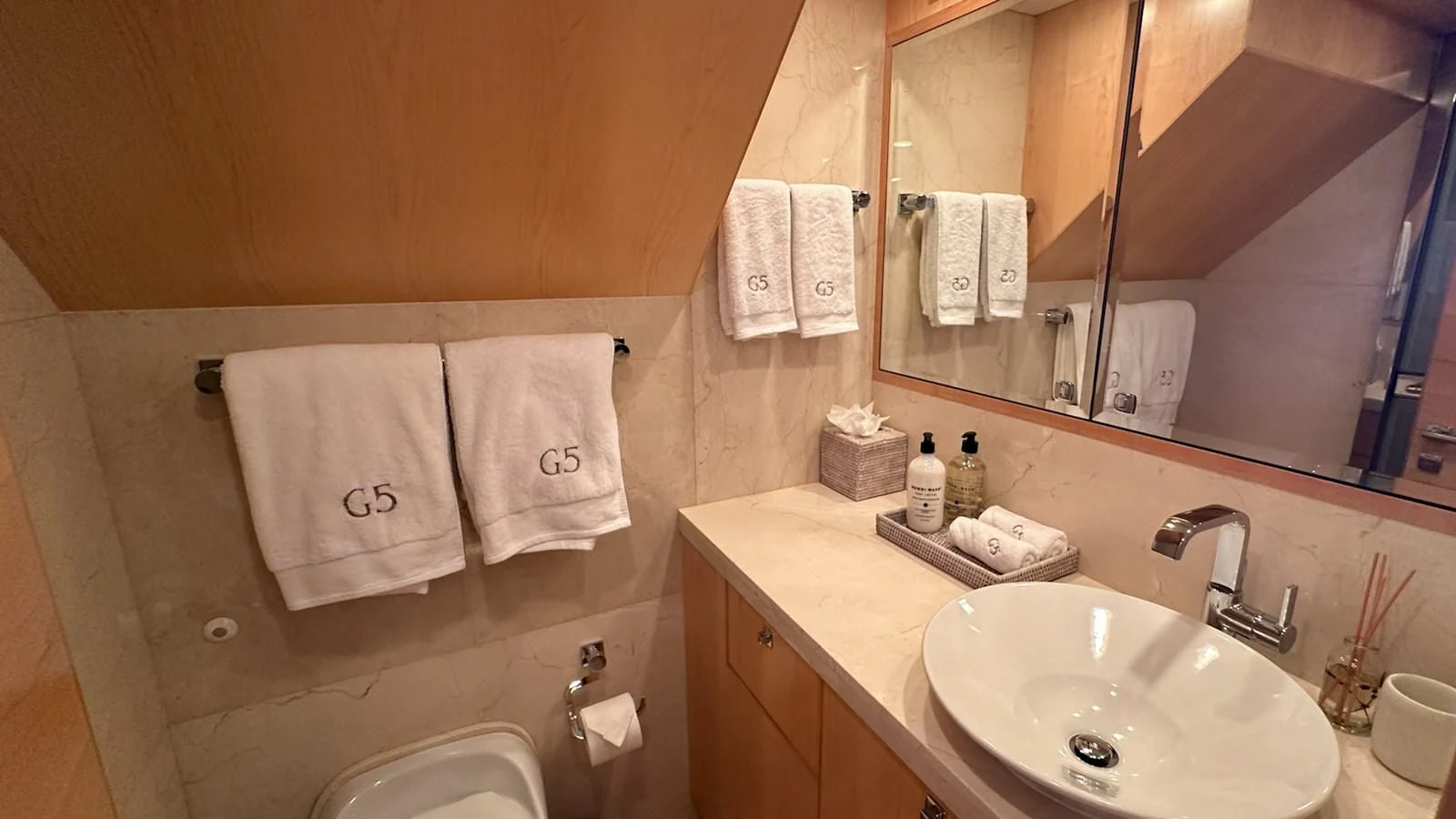 a bathroom with a large mirror aboard SALVATORE II Yacht for Sale