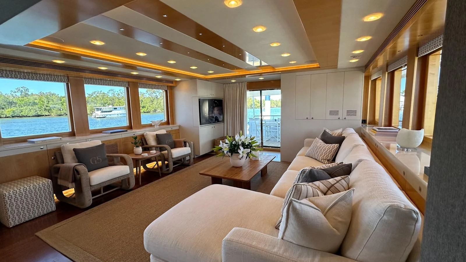 a living room with a large window aboard SALVATORE II Yacht for Sale