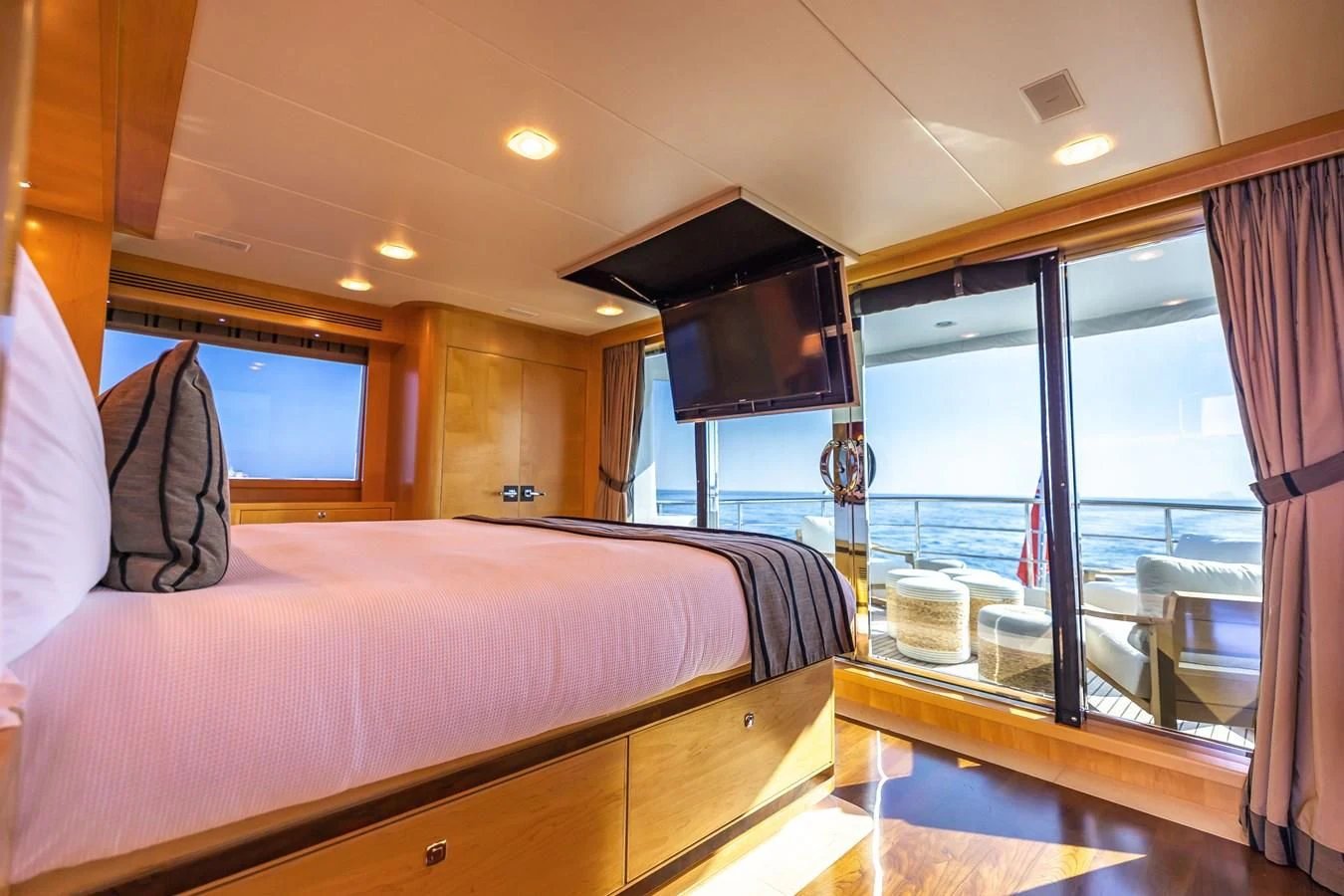 a bedroom with a large bed aboard SALVATORE II Yacht for Sale