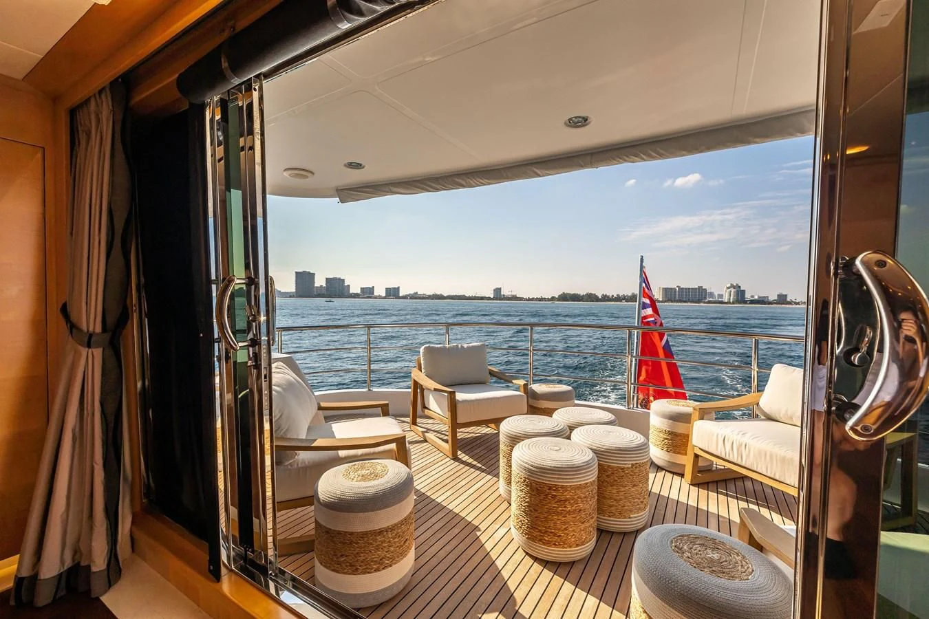 a room with a view of the water and a city aboard SALVATORE II Yacht for Sale