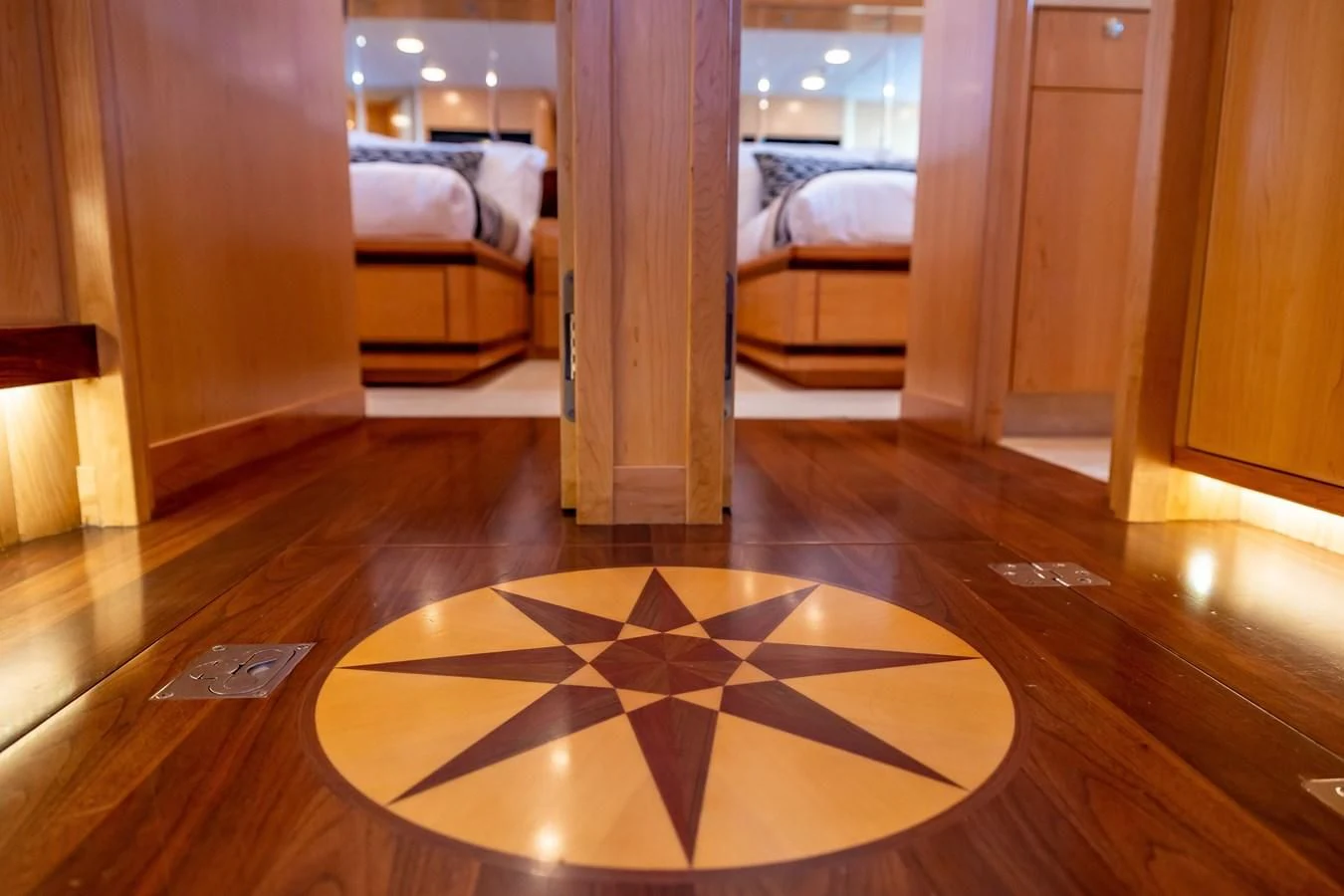 a room with a bed and a rug aboard SALVATORE II Yacht for Sale