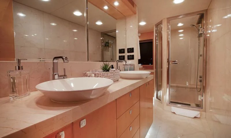 a bathroom with a large mirror aboard SALVATORE II Yacht for Sale