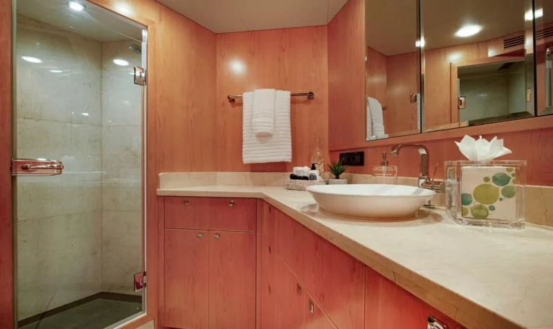 a bathroom with a sink and a shower aboard SALVATORE II Yacht for Sale