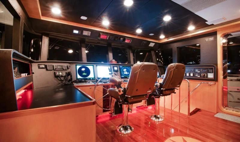 a room with a table and chairs aboard SALVATORE II Yacht for Sale