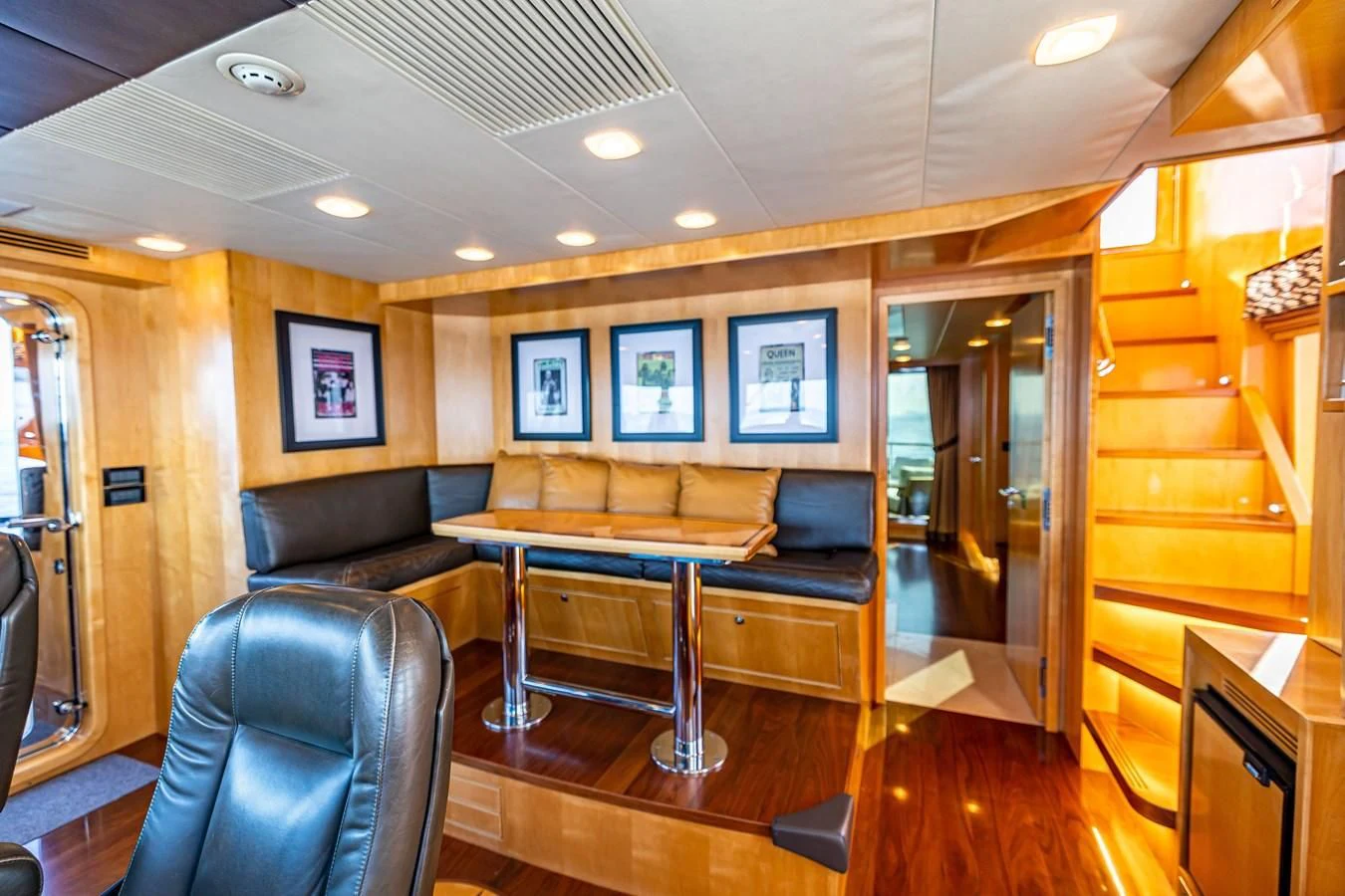 a living room with a wood floor aboard SALVATORE II Yacht for Sale