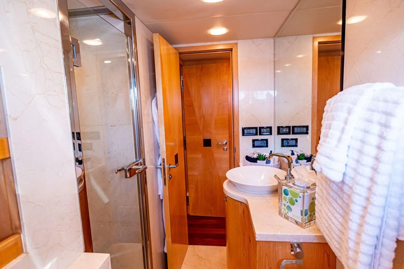 a bathroom with a sink and a mirror aboard SALVATORE II Yacht for Sale