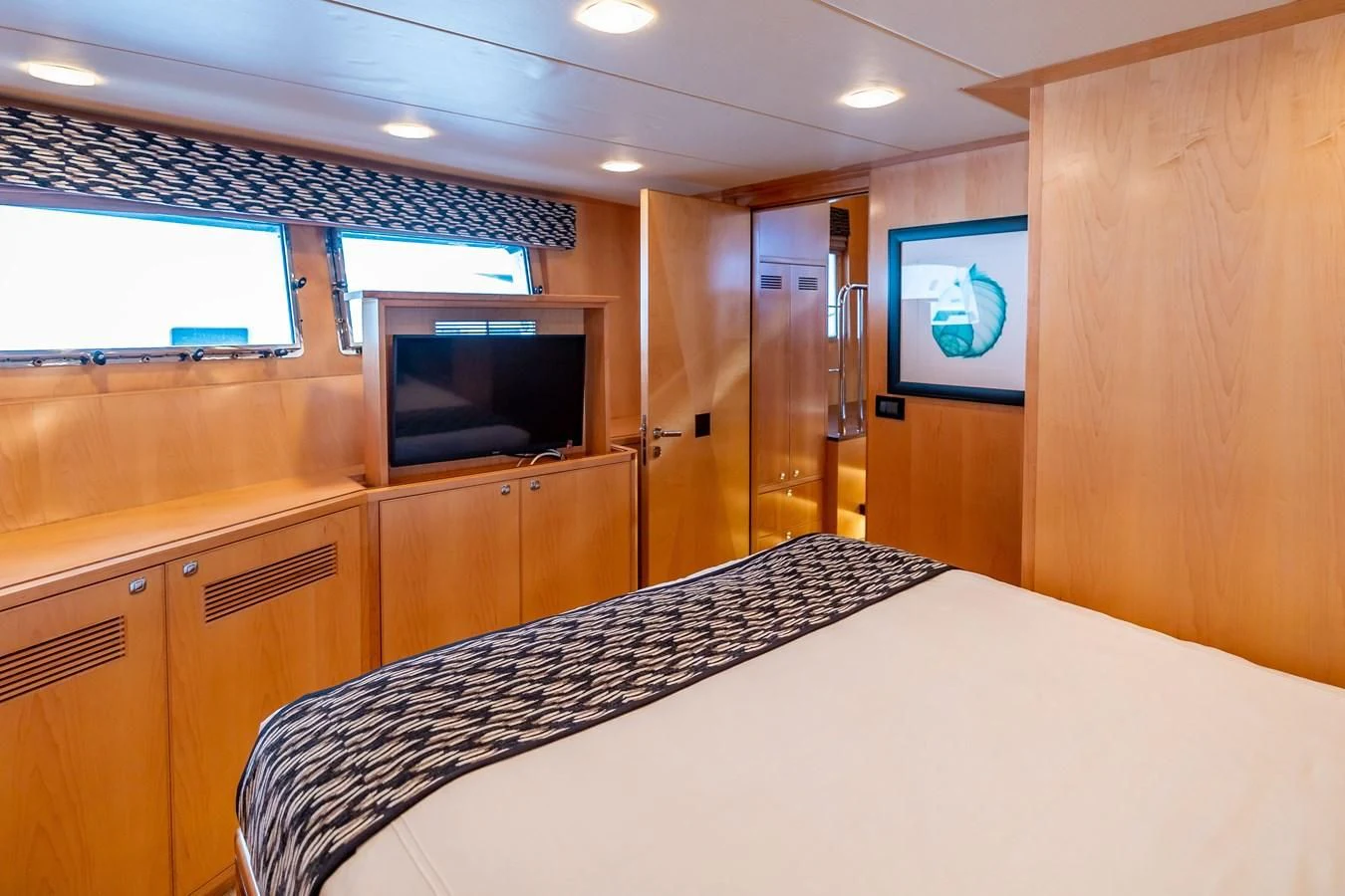 a room with a large table and tv aboard SALVATORE II Yacht for Sale