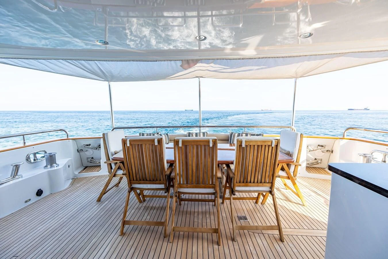 a room with a table and chairs aboard SALVATORE II Yacht for Sale