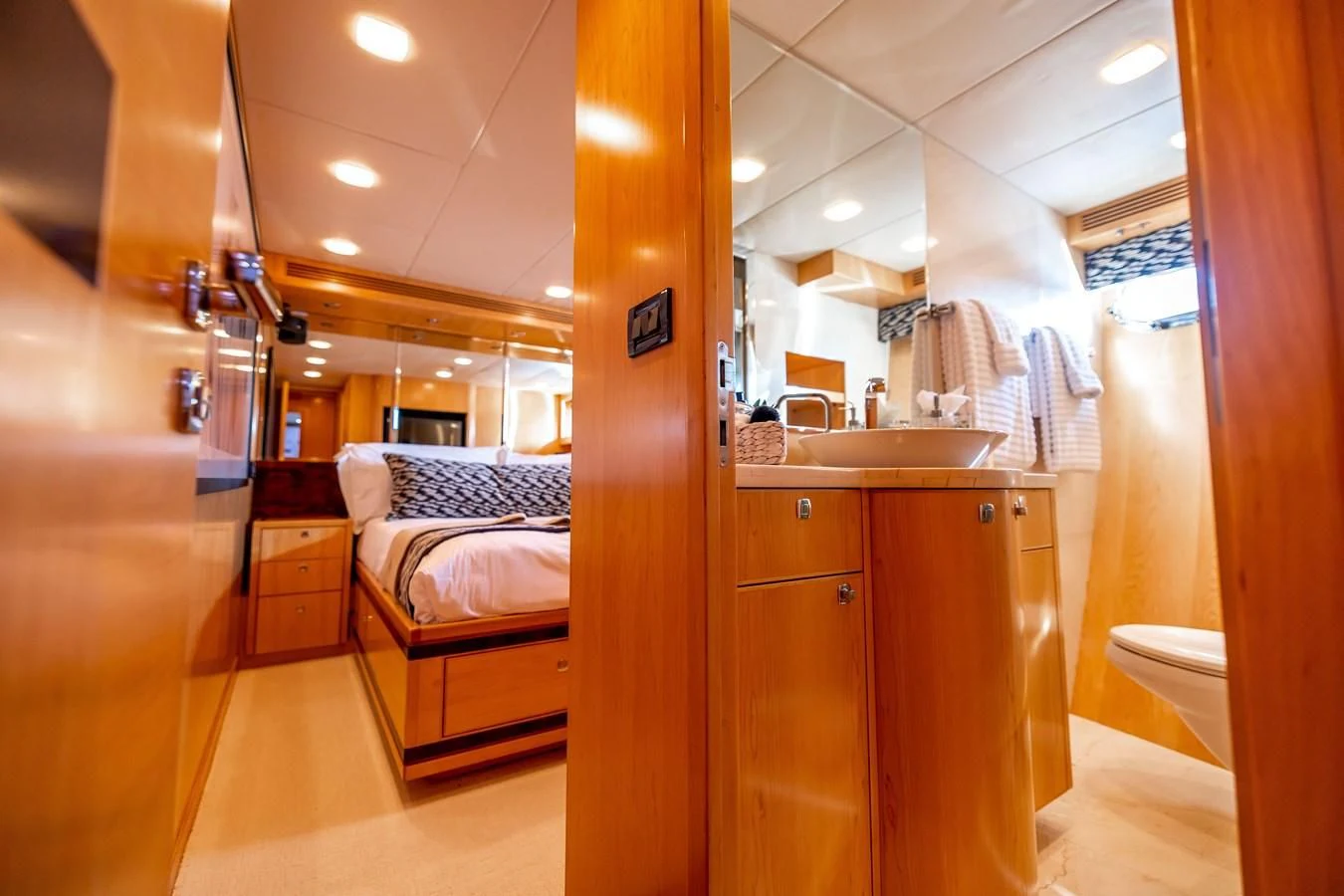 a bathroom with a sink and a bed aboard SALVATORE II Yacht for Sale