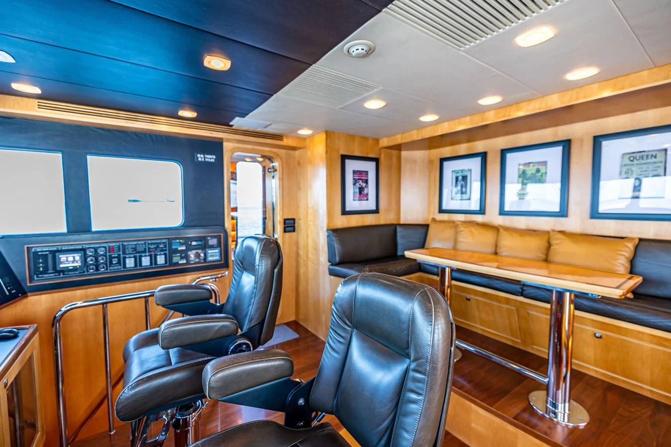 a room with a couch and a piano aboard SALVATORE II Yacht for Sale