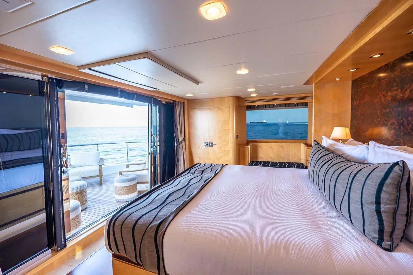 a bedroom with a large bed aboard SALVATORE II Yacht for Sale