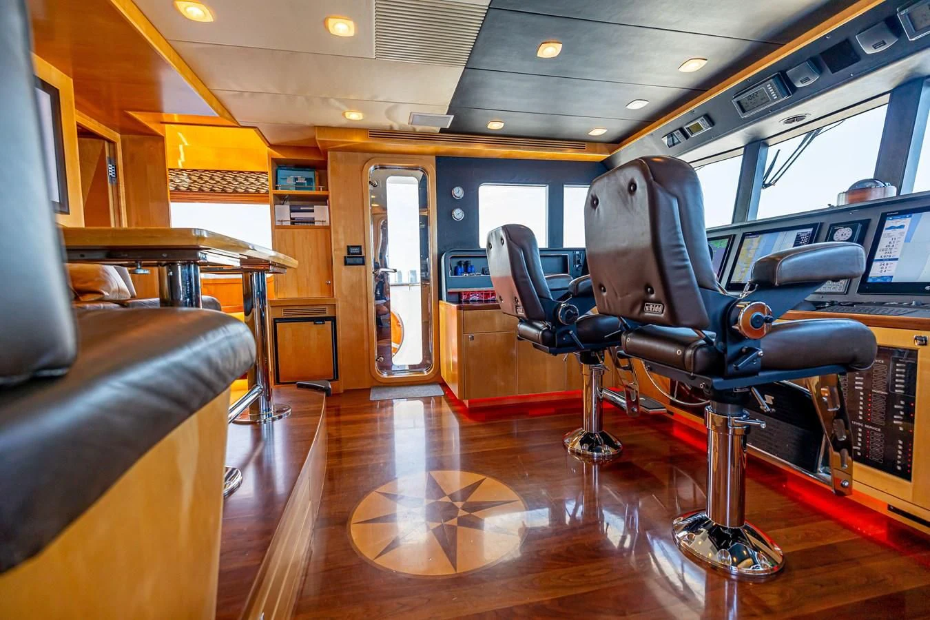 a room with chairs and a table aboard SALVATORE II Yacht for Sale