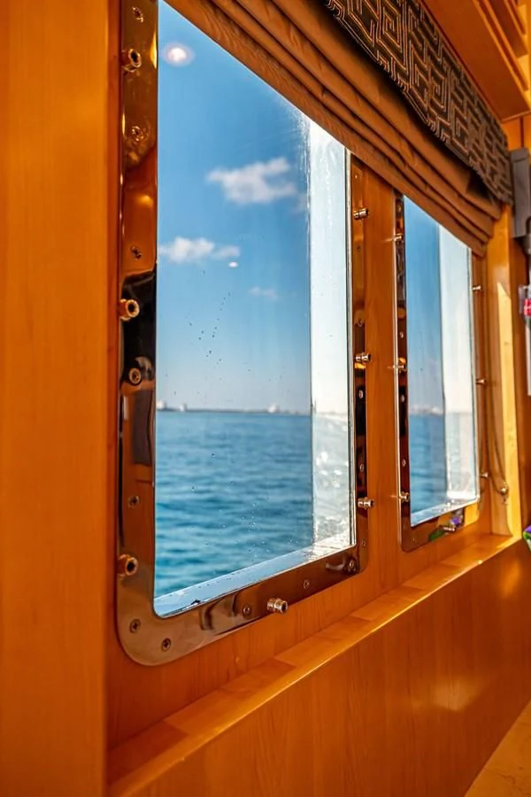 a window with a view of the ocean aboard SALVATORE II Yacht for Sale