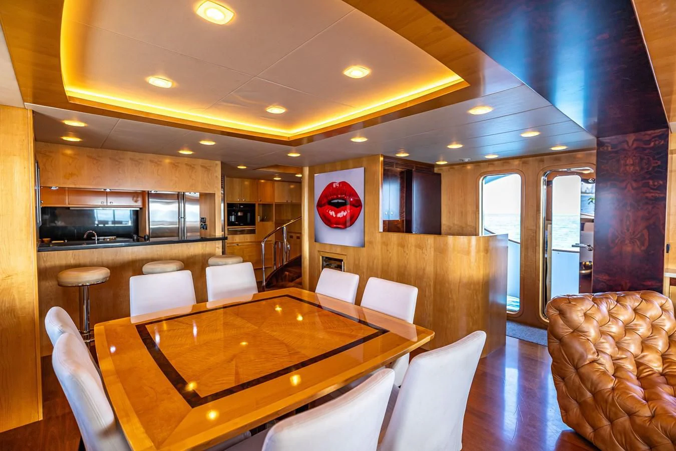 a large kitchen with a dining table aboard SALVATORE II Yacht for Sale