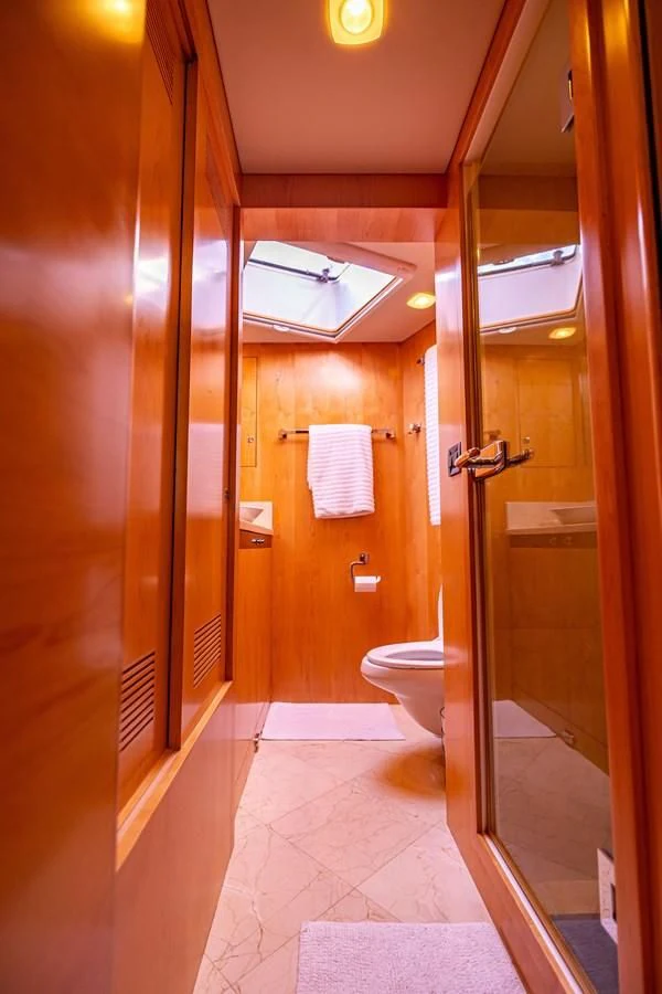 a bathroom with a glass shower aboard SALVATORE II Yacht for Sale