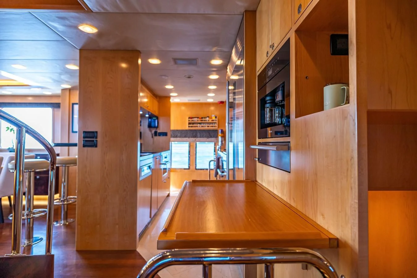 a large kitchen with a wood floor aboard SALVATORE II Yacht for Sale