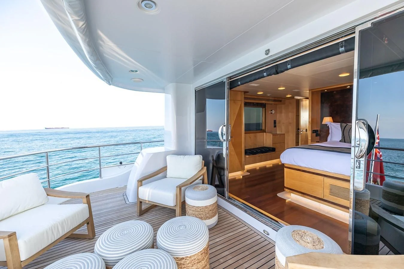 a room with a view of the ocean and the deck aboard SALVATORE II Yacht for Sale