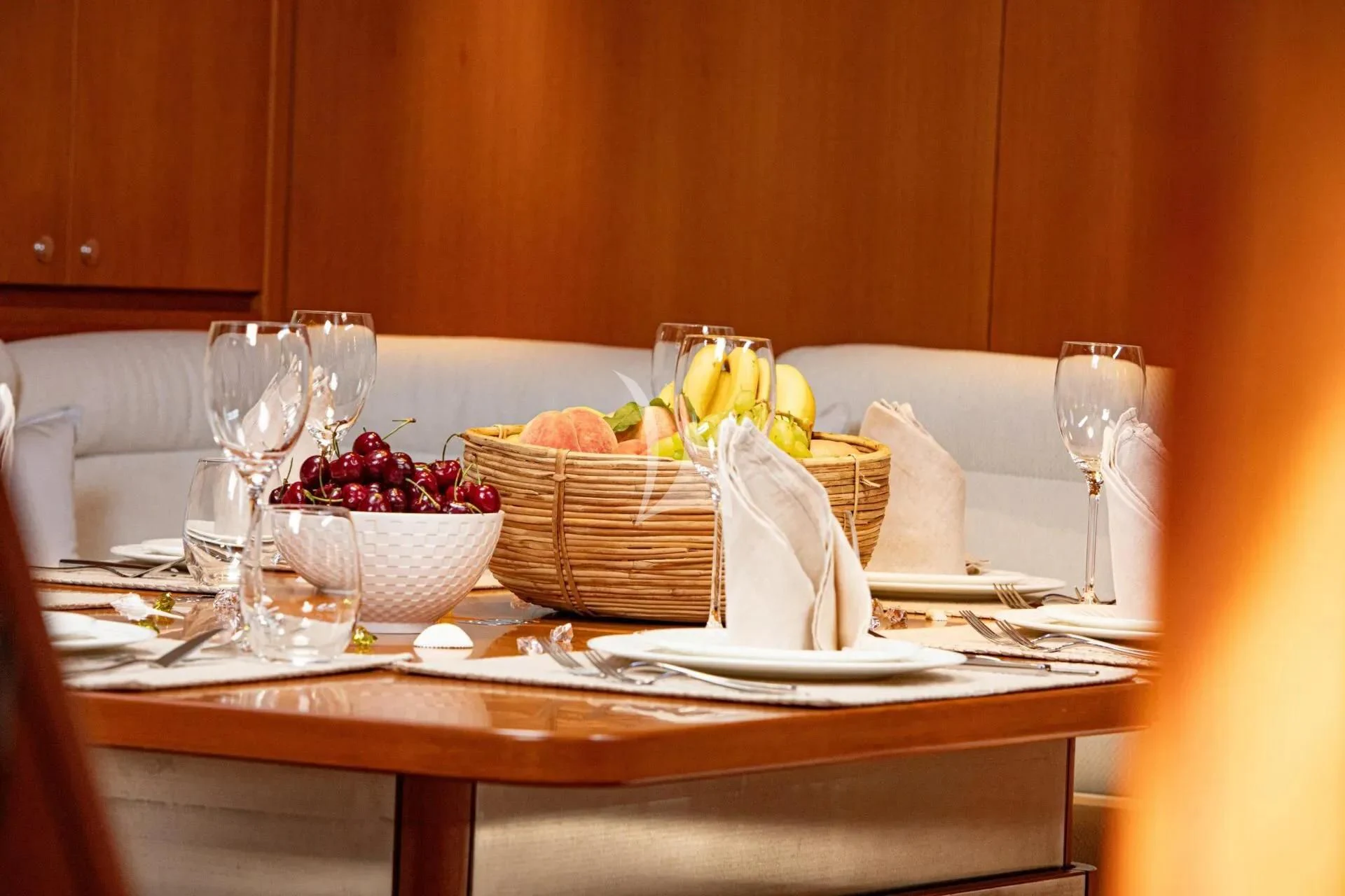 a table with food and wine aboard ARIA Yacht for Charter