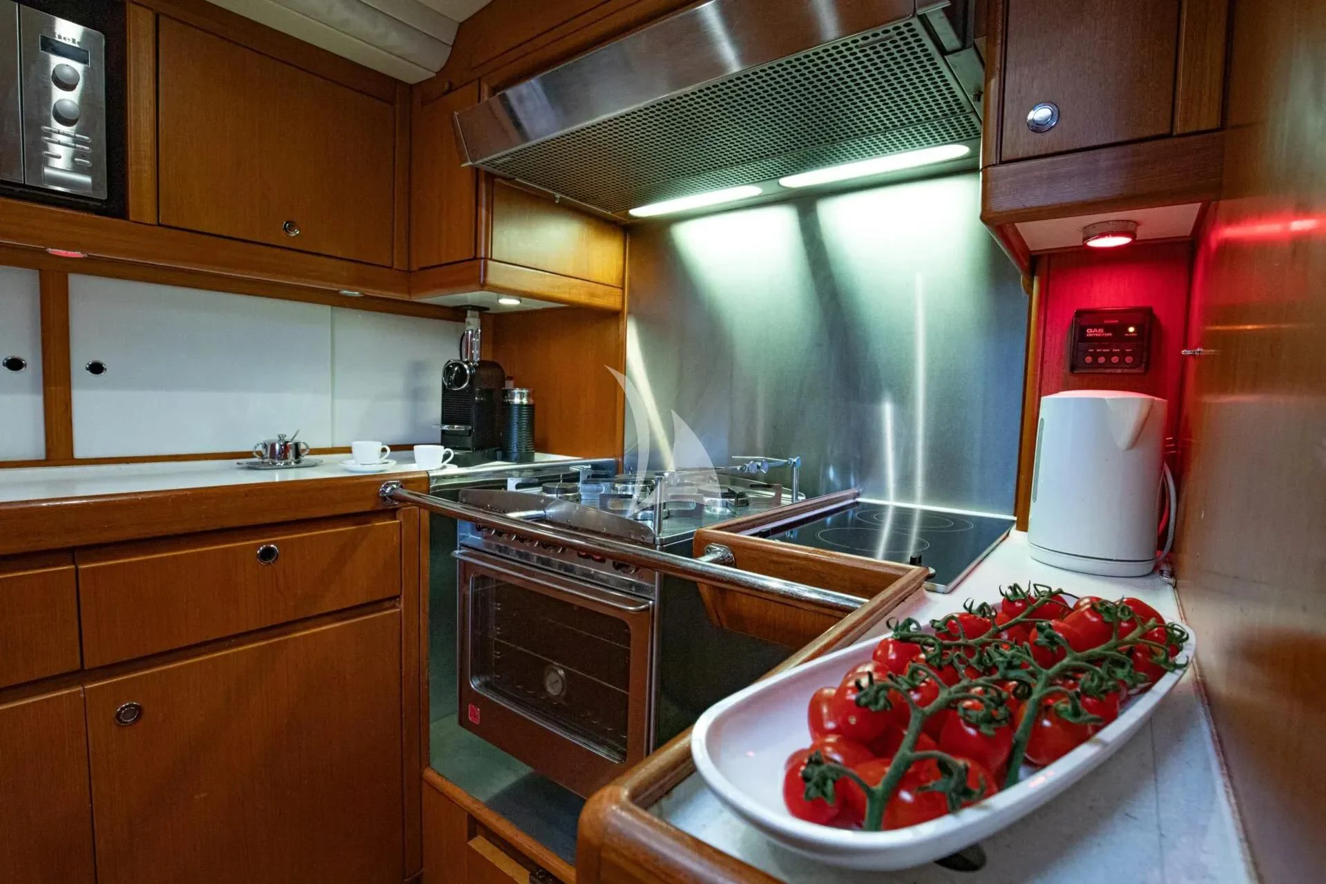 a kitchen with a sink and a stove aboard ARIA Yacht for Charter