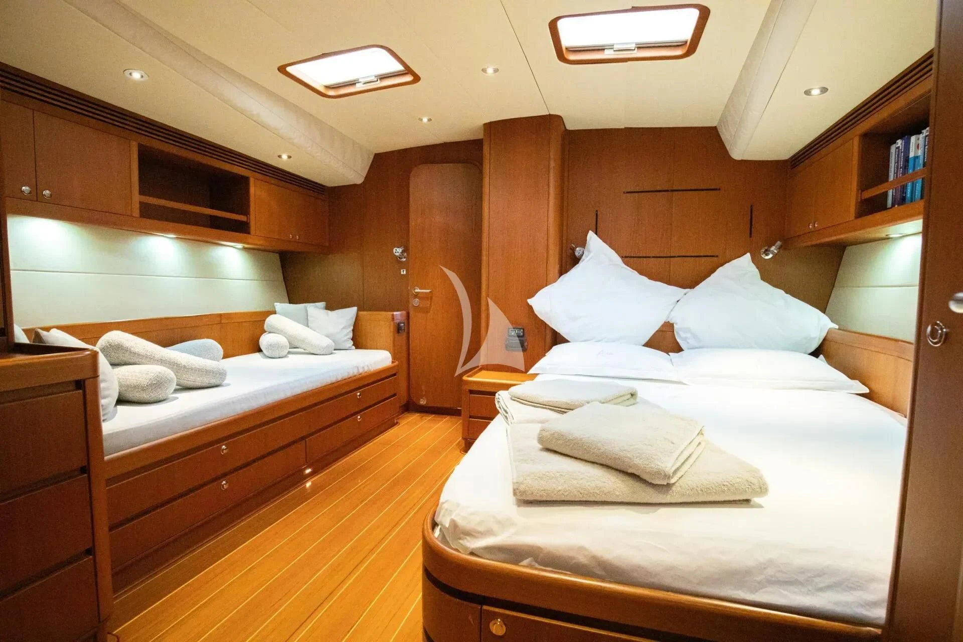 a room with two beds aboard ARIA Yacht for Charter