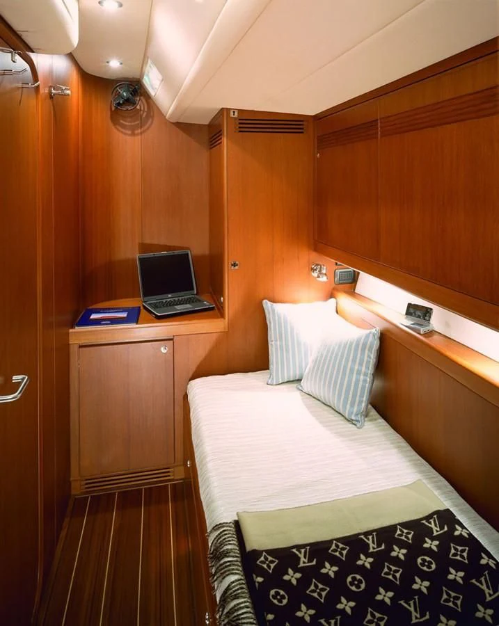 a laptop on a desk aboard ARIA Yacht for Charter