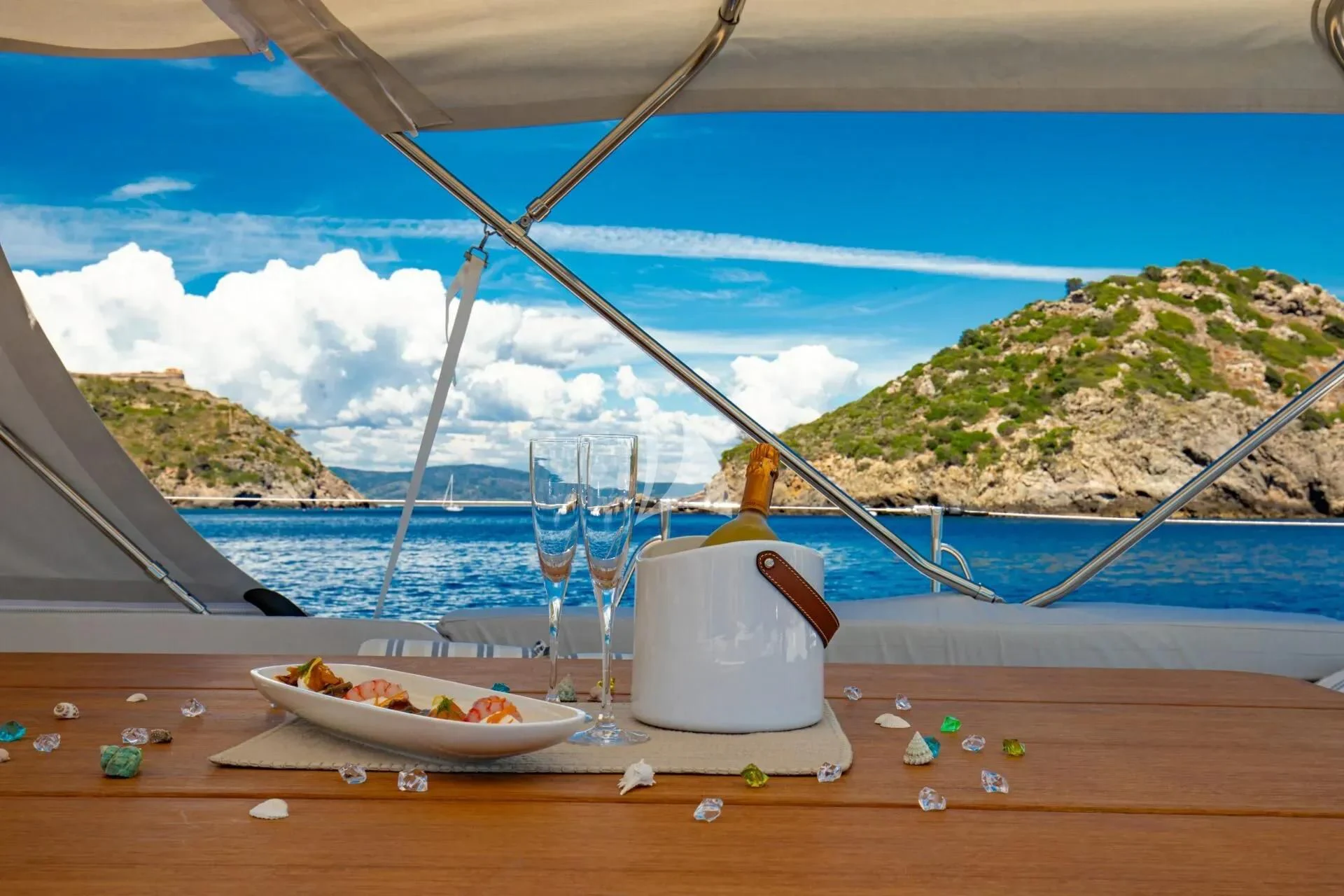 a glass vase on a table aboard ARIA Yacht for Charter