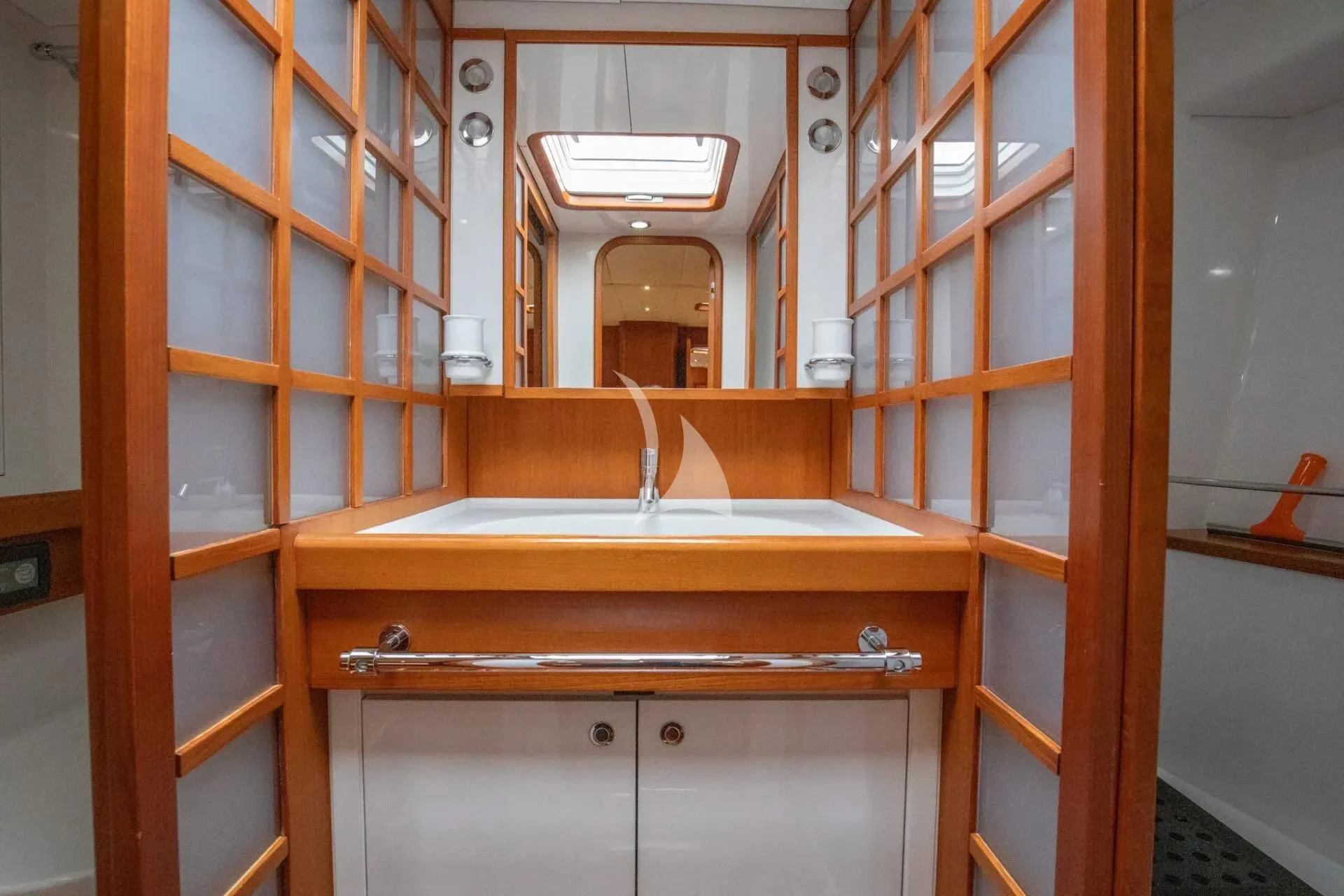 a kitchen with a sink and cabinets aboard ARIA Yacht for Charter