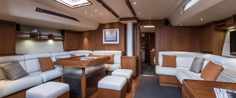 a room with a couch and a table aboard ARIA Yacht for Charter